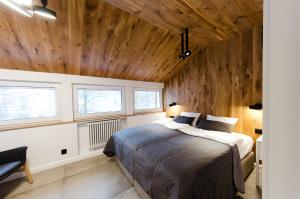 Posteľ alebo postele v izbe v ubytovaní Apartament Dębowy