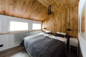 Posteľ alebo postele v izbe v ubytovaní Apartament Dębowy