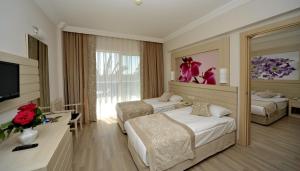 Кровать или кровати в номере Seaden Corolla Hotel