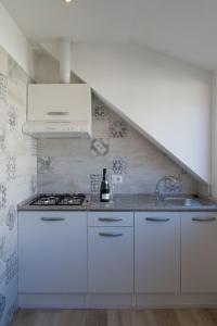 Kuchyň nebo kuchyňský kout v ubytování Appartamento Mykonos