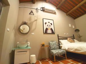 Postel nebo postele na pokoji v ubytování Zhu Shan Homestay