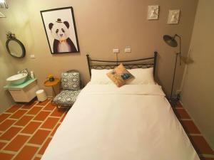 Postel nebo postele na pokoji v ubytování Zhu Shan Homestay