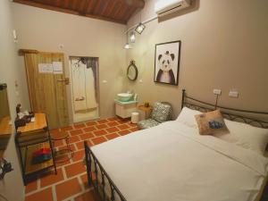 Postel nebo postele na pokoji v ubytování Zhu Shan Homestay