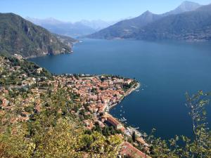 an aerial view of a town next to a body of water at Hotel Du Lac Menaggio in Menaggio