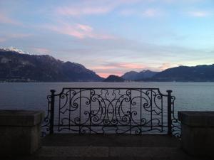 a view of a body of water with mountains at Hotel Du Lac Menaggio in Menaggio