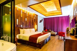 En eller flere senger på et rom på Aonang Phu Pi Maan Resort & Spa