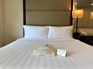 Postel nebo postele na pokoji v ubytování Jinjiang Inn - Boracay Station 1