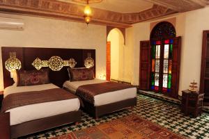 Postel nebo postele na pokoji v ubytování Riad El Amine Fès - Historic Hotels Worldwide