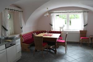 a kitchen with a table and chairs and a window at Perau in Gmünd in Gmünd in Kärnten