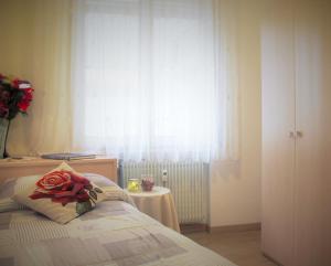 Postel nebo postele na pokoji v ubytování Bed & Breakfast Delle Rose
