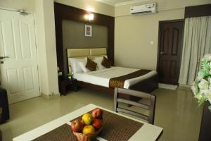 Postel nebo postele na pokoji v ubytování Hotel Pearl International + 37 fotografií