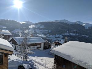 a view of a snow covered mountain from a house at Casa Letizia in Breil/Brigels
