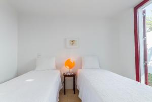 Ένα ή περισσότερα κρεβάτια σε δωμάτιο στο Quinta da Várzea do Farelo