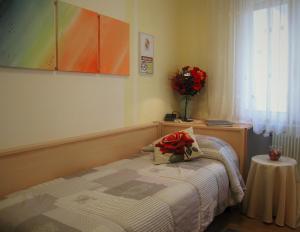 Postel nebo postele na pokoji v ubytování Bed & Breakfast Delle Rose