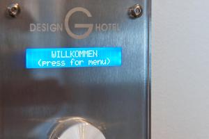 a sign on the side of a washing machine at G Design Hotel in Ljubljana