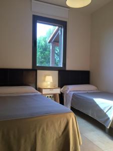 Posteľ alebo postele v izbe v ubytovaní Casa bonmont con vistas al mar piscina y port aventura