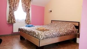 Postel nebo postele na pokoji v ubytování Hotel