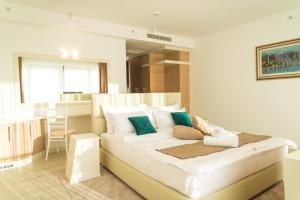 Postel nebo postele na pokoji v ubytování Hotel Kadmo by Aycon
