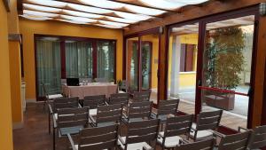 a room with chairs and a table in it at UNAHOTELS Eco Hotel Villa Costanza Venezia in Mestre