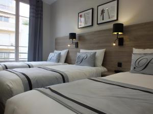 Postel nebo postele na pokoji v ubytování Hotel Paganini