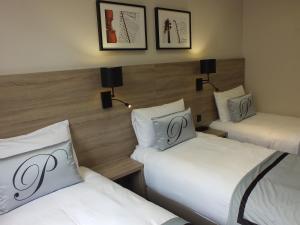 Postel nebo postele na pokoji v ubytování Hotel Paganini