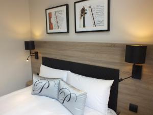 Postel nebo postele na pokoji v ubytování Hotel Paganini