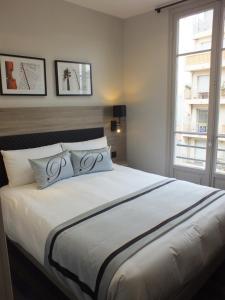 Postel nebo postele na pokoji v ubytování Hotel Paganini