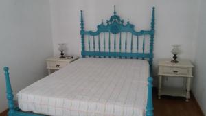 Tempat tidur dalam kamar di Casa da Madrinha II