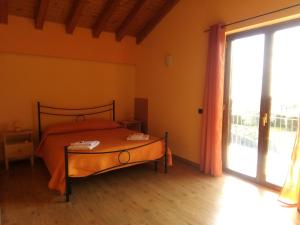 Кровать или кровати в номере Aurora dell'Etna
