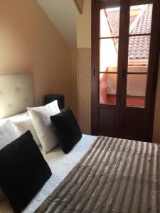 Posteľ alebo postele v izbe v ubytovaní Apartamento Conde Luna
