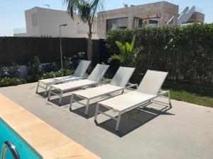The swimming pool at or close to Casa de lujo frente a la playa de Es Trenc