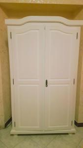 two white garage doors in a room at Albergo Panorama in Frascati