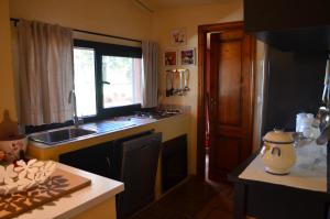 Cuisine ou kitchenette dans l'établissement Il Belvedere house in the Tuscan countryside