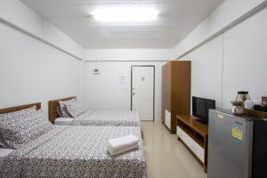 Postel nebo postele na pokoji v ubytování I-Home Residence and Hotel