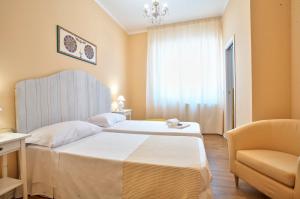 A bed or beds in a room at B&B Del Corso