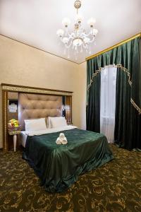 Кровать или кровати в номере Отель Империя
