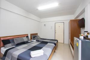 Postel nebo postele na pokoji v ubytování I-Home Residence and Hotel