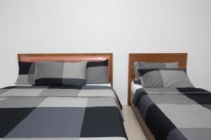 Postel nebo postele na pokoji v ubytování I-Home Residence and Hotel