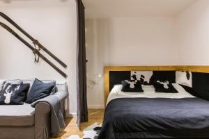 Łóżko lub łóżka w pokoju w obiekcie Apartament Czarny Staw