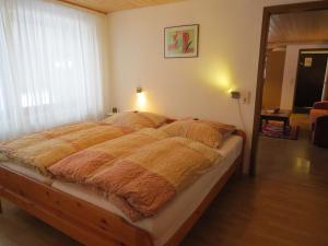 מיטה או מיטות בחדר ב-Ferienhaus Ziegler