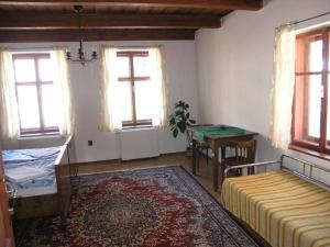 Postel nebo postele na pokoji v ubytování Penzion Novopacké Sklepy
