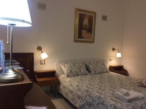 Postel nebo postele na pokoji v ubytování Gianmaria B&B