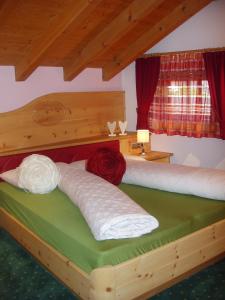 מיטה או מיטות בחדר ב-Appartamenti Loretta