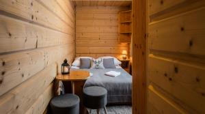 En eller flere senge i et værelse på Pokoje Gościnne Chochołów