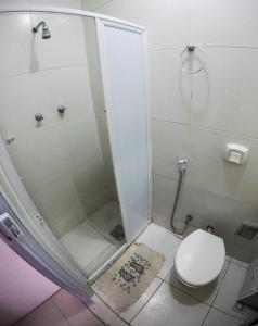 a small bathroom with a shower and a toilet at Baixo Copa Guest House in Rio de Janeiro +61 photos