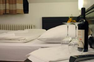 Postel nebo postele na pokoji v ubytování Hotel Komovi