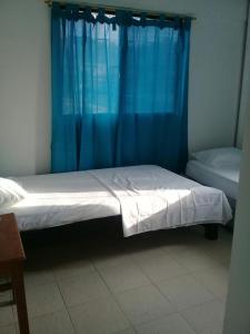 Hotel Paseo Bolivar客房内的一张或多张床位