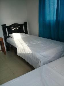 Hotel Paseo Bolivar客房内的一张或多张床位