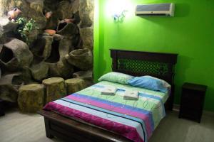 A bed or beds in a room at Posada El Abuelo