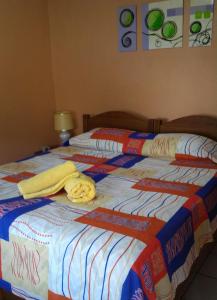 Cama o camas de una habitación en Pousada do Beijaflor
